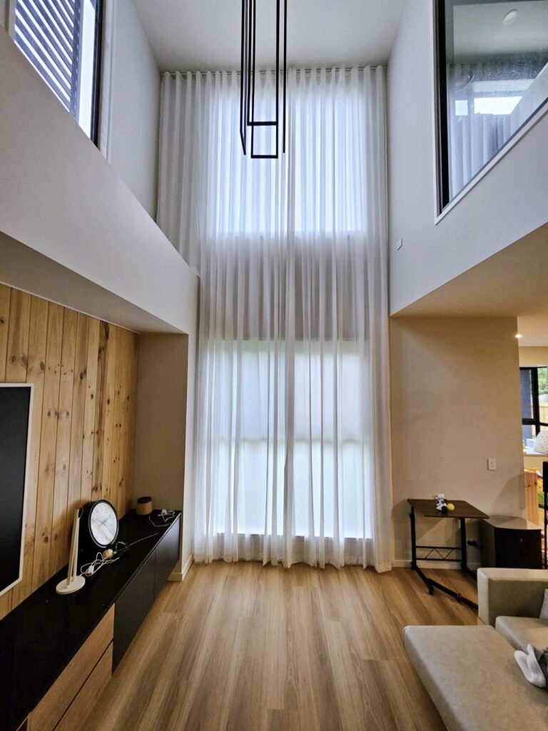 S-fold privacy sheers elegantly installed on a void window.