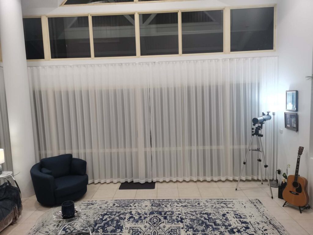 installed s fold transparent sheer for double open in the living room