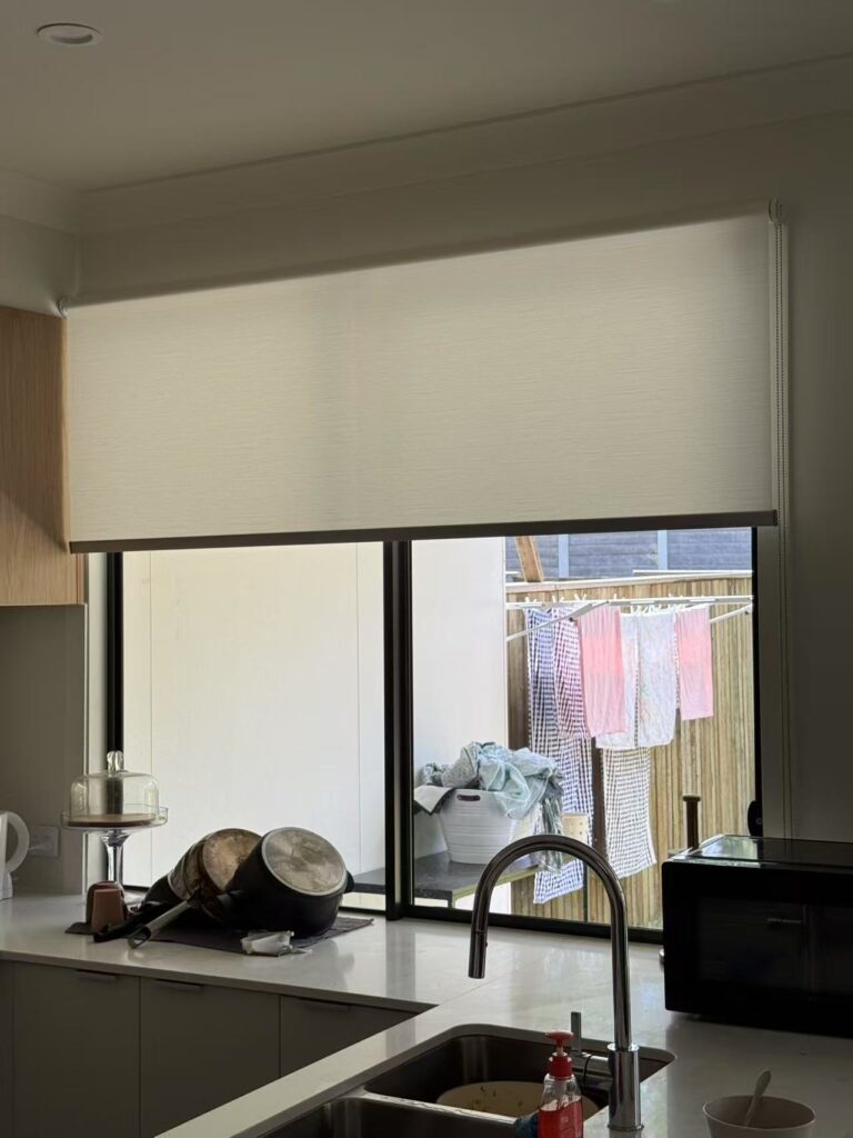 light filtering privacy roller blind installed in the kitchen