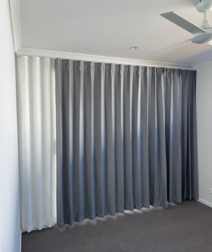 pinch blockout curtain with s fold privacy sheer installed for bedroom window