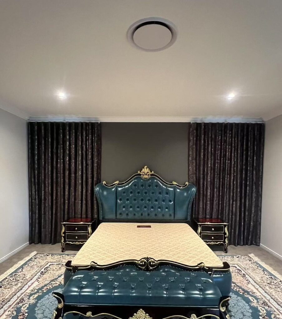 s fold blockout curtain installed between bed in the master bedroom