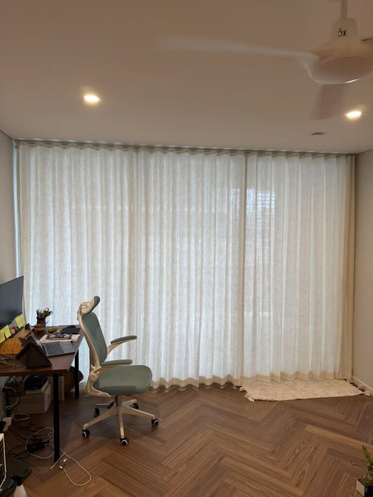 s fold linen sheer installed for sliding door in study room