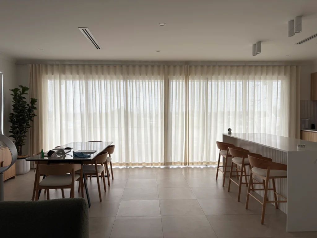 s fold linen sheers installed for kitchen and living area's windows