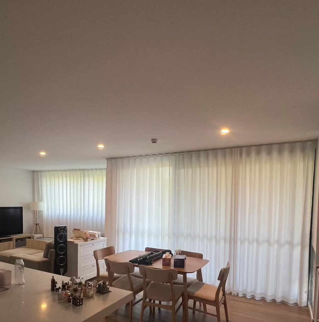 s fold privacy sheers installed in the dining and living area