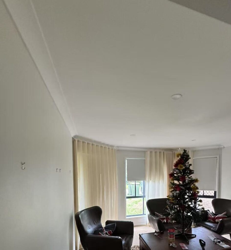 s fold sheer with grey blockout roller blinds installed for by windows in activity area