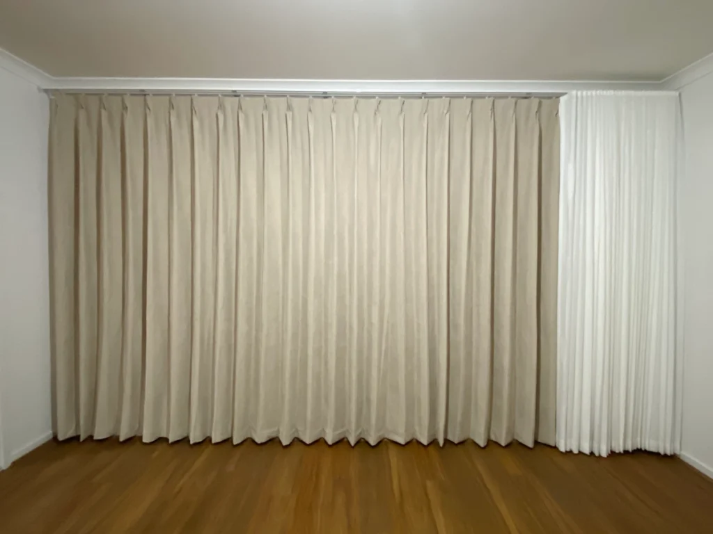 s fold sheer with pinch blockout curtain installed for one window