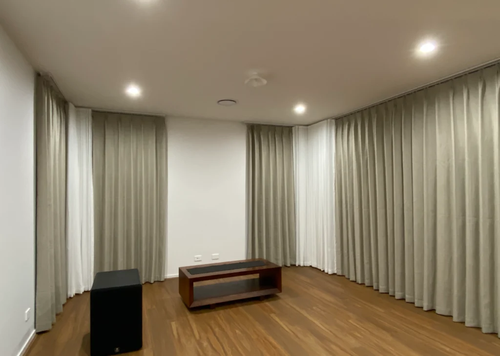 s fold sheers with pinch blockout curtains installed for the living area's windows