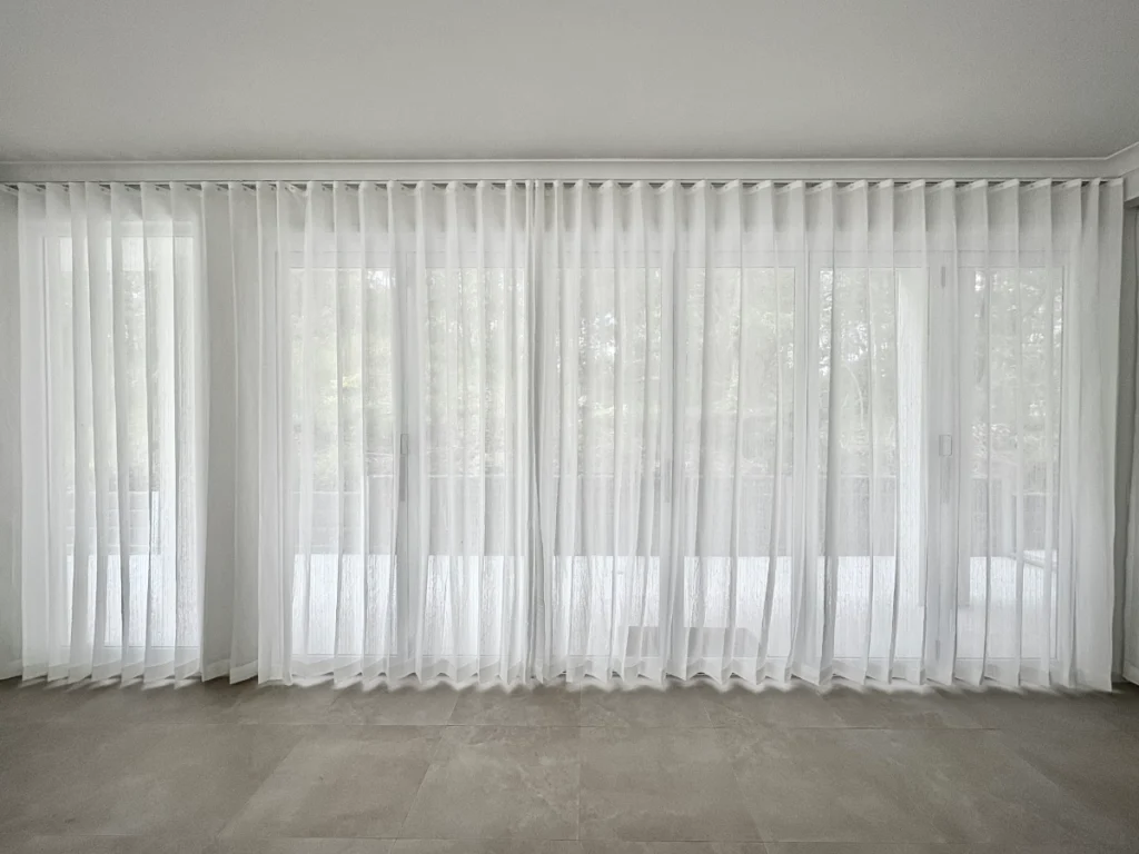s fold transparent sheer installed for sliding door and window in living area