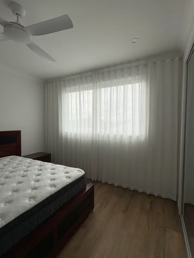 s fold transparent sheer installed full wall size for one window in bedroom