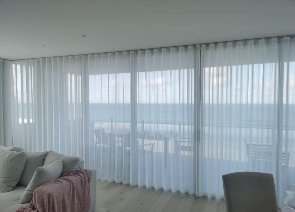 s fold transparent sheer installed in living room