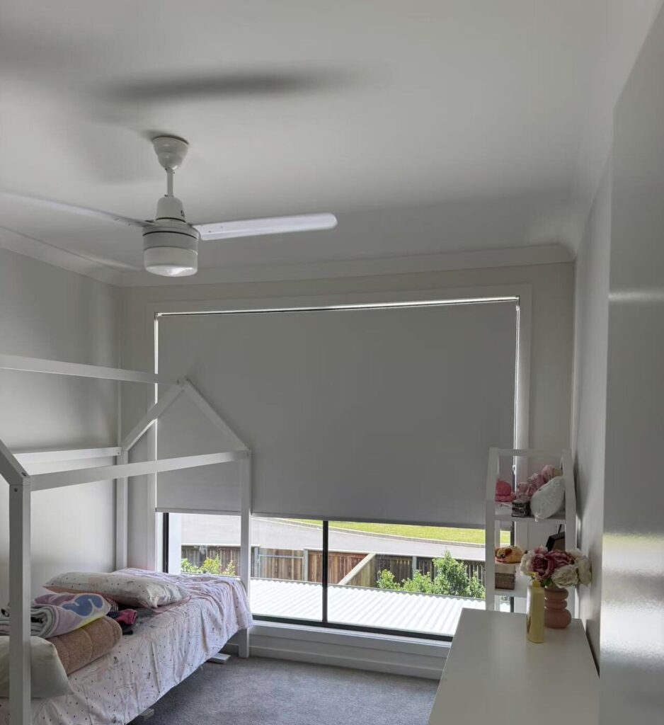 white blockout roller blind installed in the child room