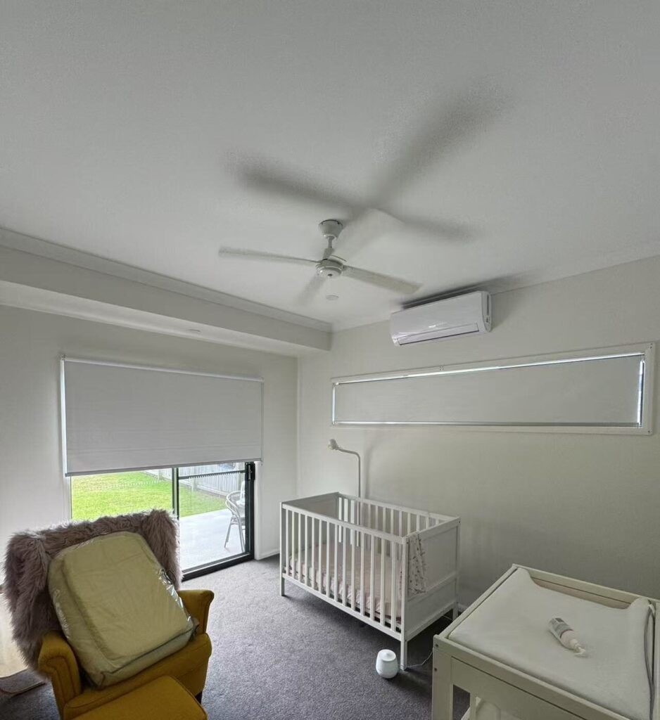 white blockout roller blinds installed for sliding door and window in child room
