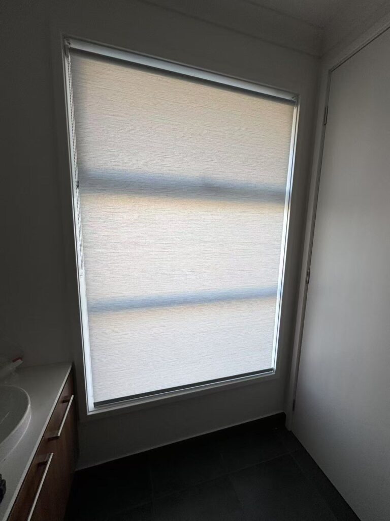 white light filtering privacy roller blind installed for one window