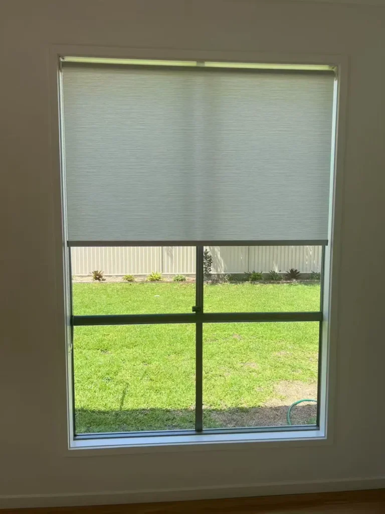 white light filtering privacy roller blind installed in living room